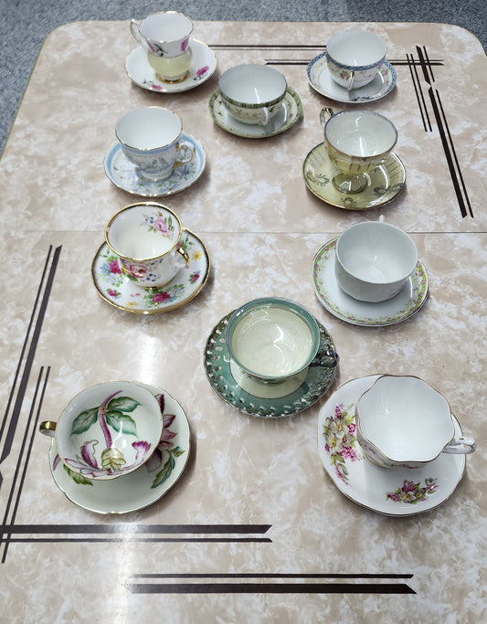 Set of 10 teacups with saucers