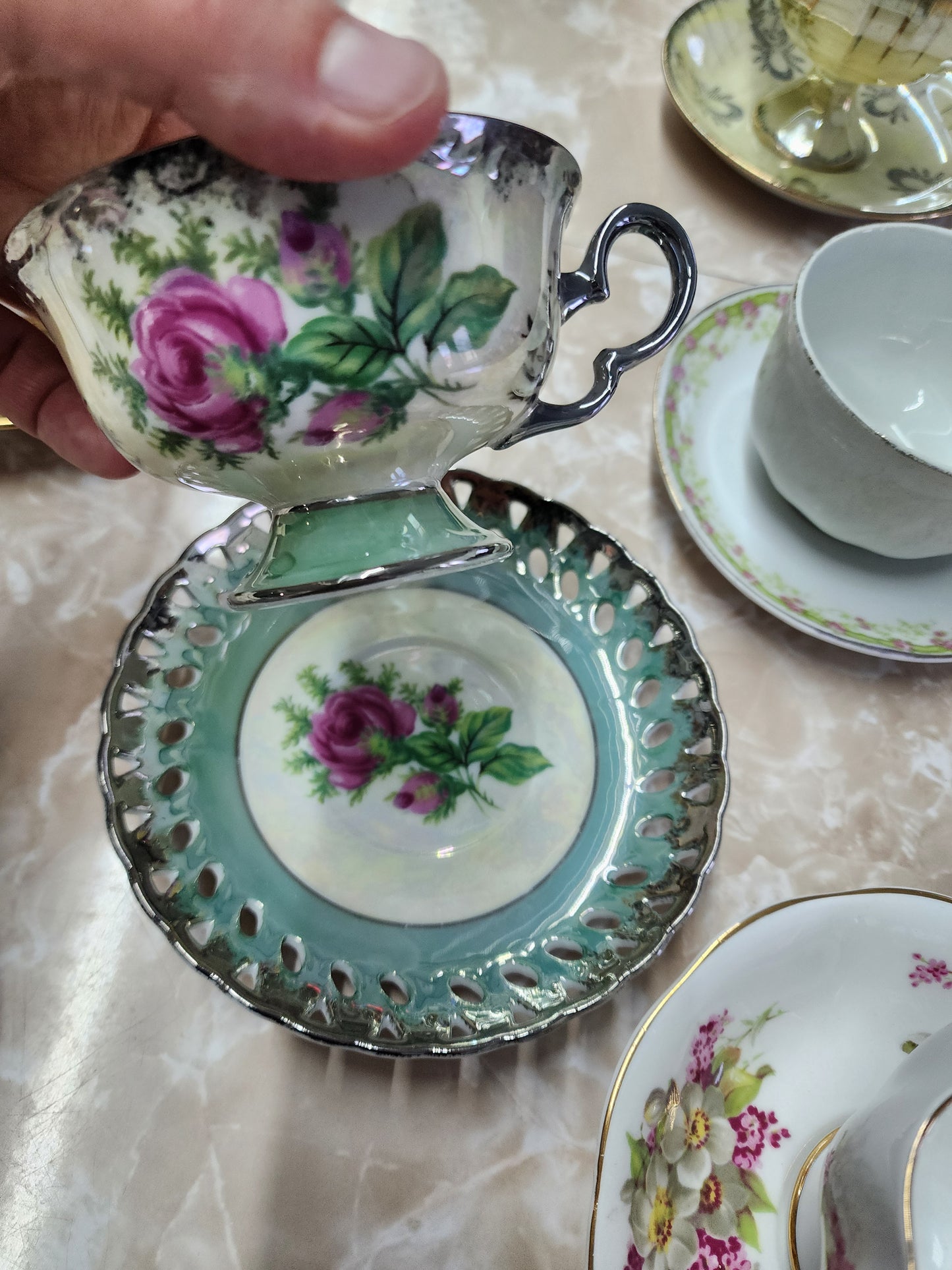 Set of 10 teacups with saucers