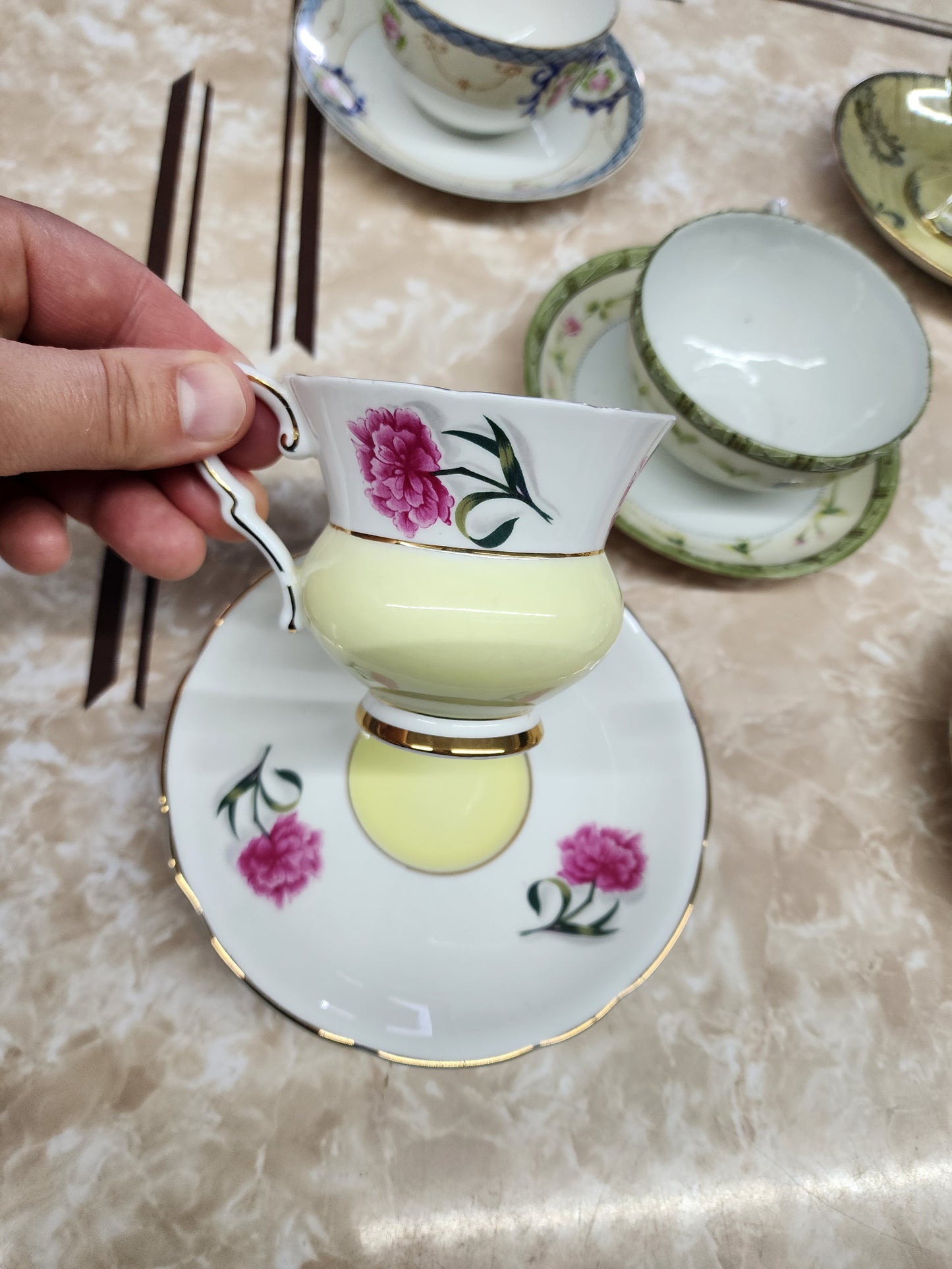 Set of 10 teacups with saucers