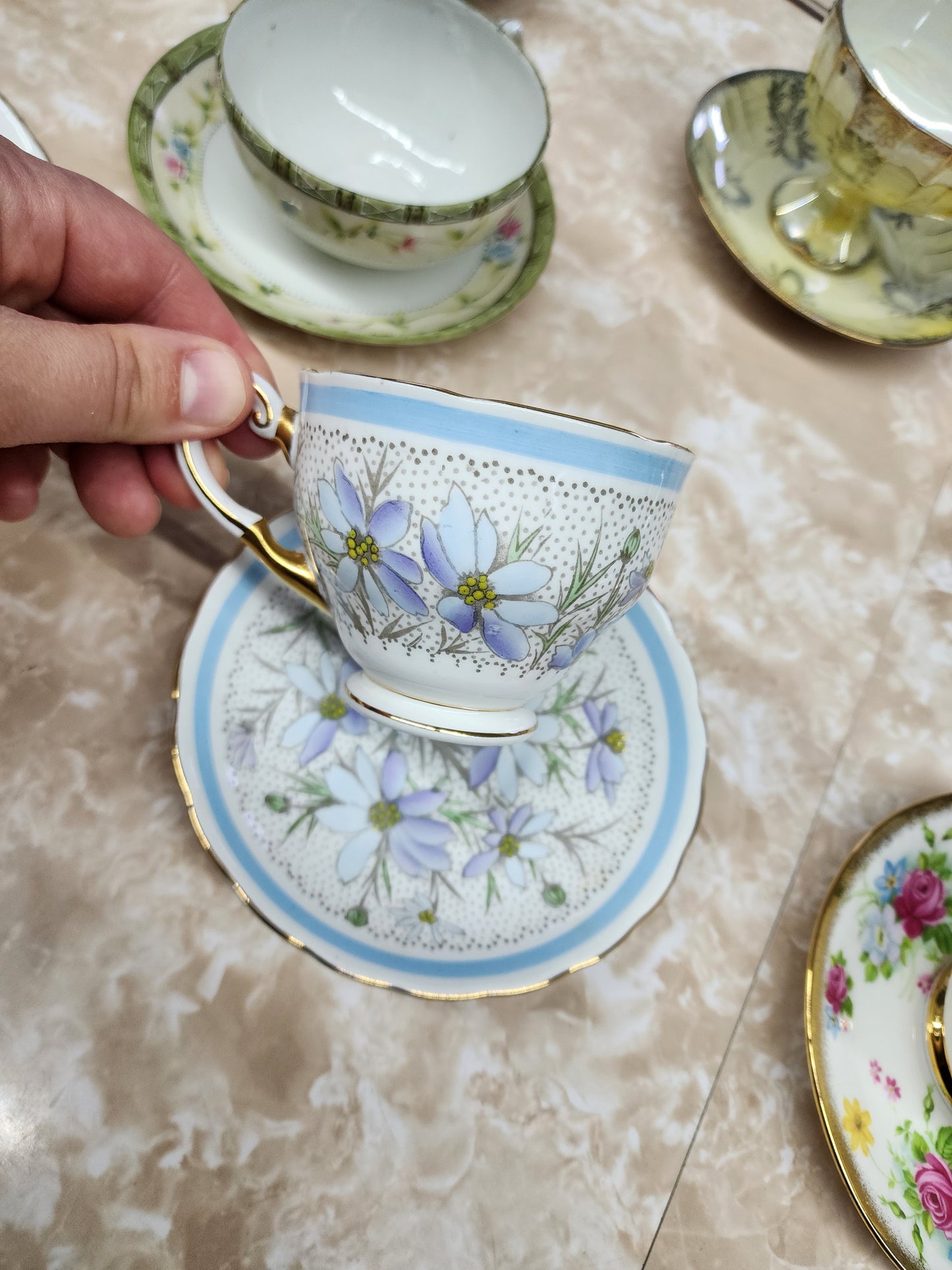 Set of 10 teacups with saucers