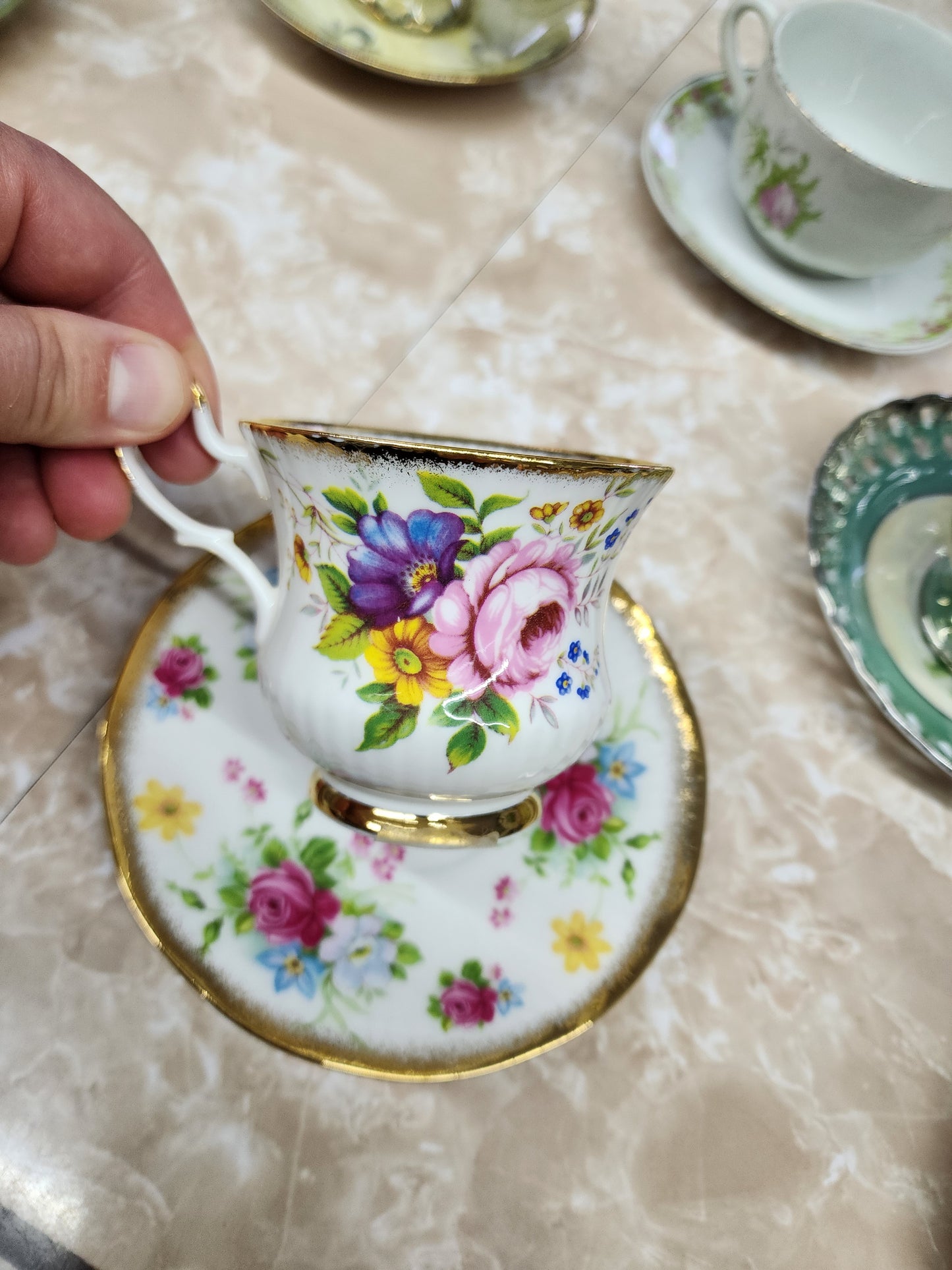 Set of 10 teacups with saucers